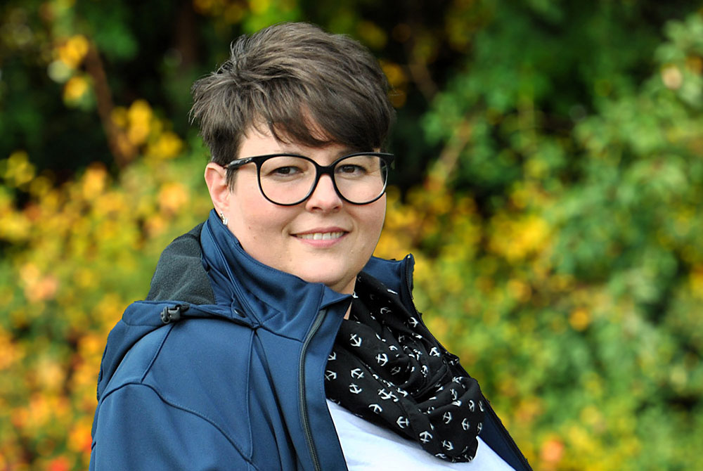 Smiling Female Business Leader With Arms Crossed