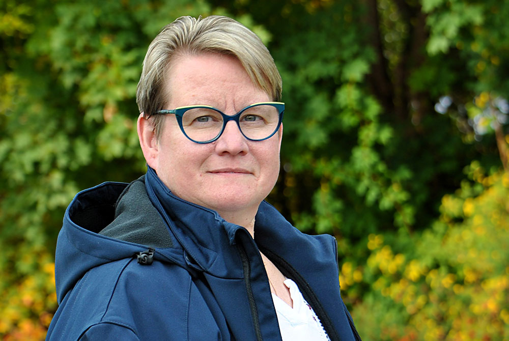 Smiling Female Business Leader With Arms Crossed