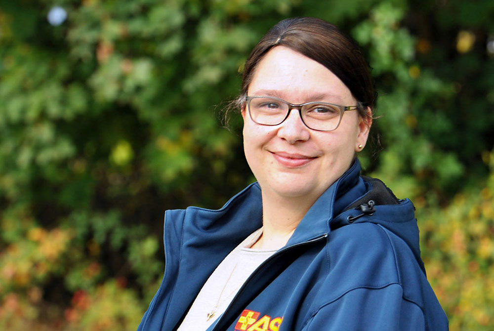 Smiling Female Business Leader With Arms Crossed
