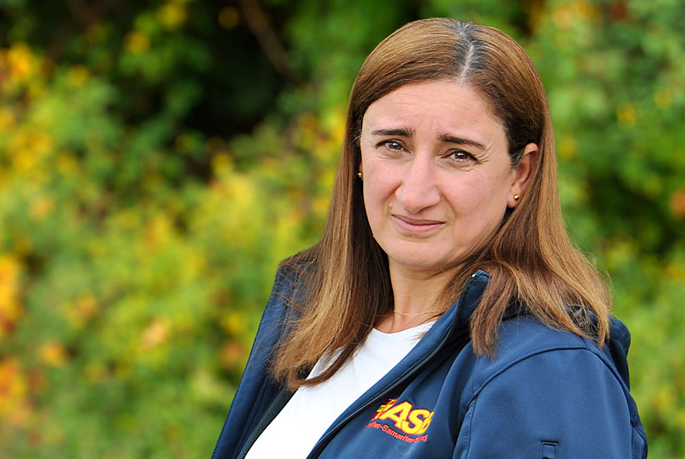 Smiling Female Business Leader With Arms Crossed